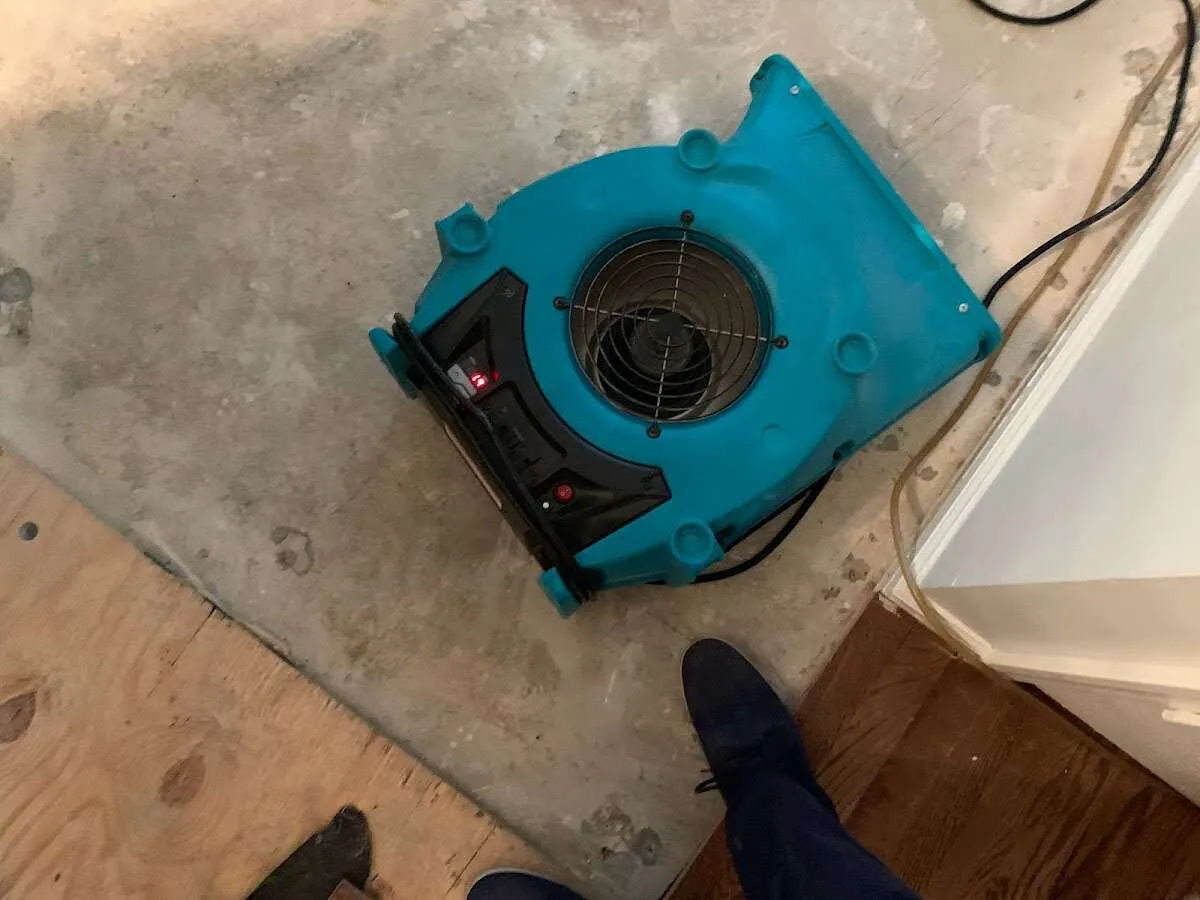 Air mover drying subfloor during Commercial Water Damage Restoration in High Springs